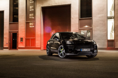 Porsche Macan Techart Tuning in black on the street, front side view.